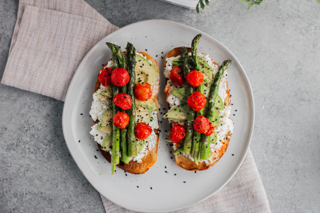 Avocado Toast with Grilled Asparagus and Tomatoes with Farmer Cheese