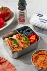 Easy Protein Veggie Wraps made with Lifeway Farmer Cheese packed in a lunchbox with Lifeway Muscle Mates