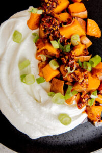 Roasted Sweet Potatoes with Whipped Farmer Cheese and Chili Crisp made with Lifeway Farmer Cheese