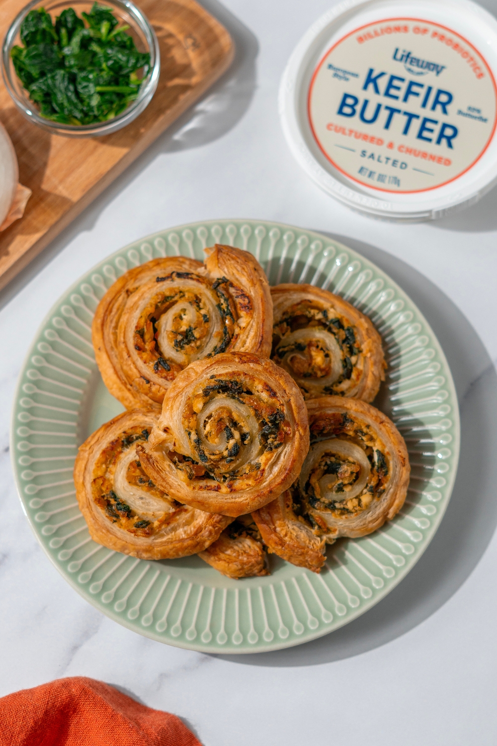 Spinach and Caramelized Onion Farmer Cheese Pinwheels made with Lifeway Farmer Cheese and Lifeway Kefir Butter