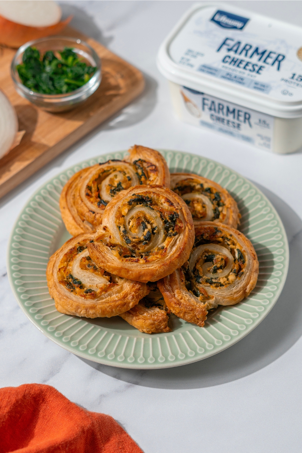 Spinach and Caramelized Onion Farmer Cheese Pinwheels made with Lifeway Farmer Cheese and Lifeway Kefir Butter